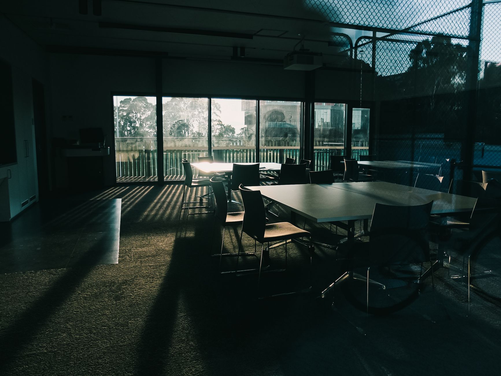 Empty meeting room viewed through glass